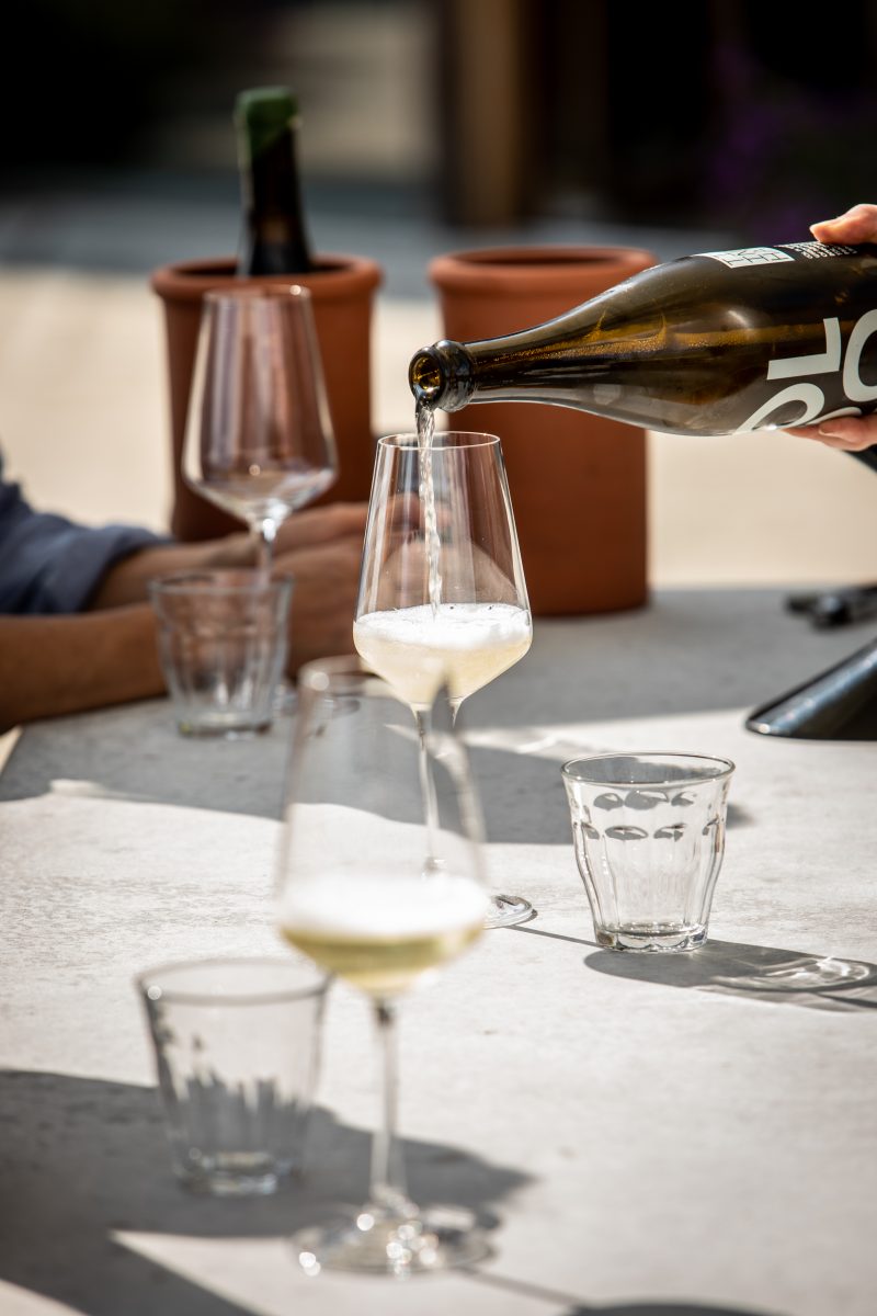 White wine being poored on a table